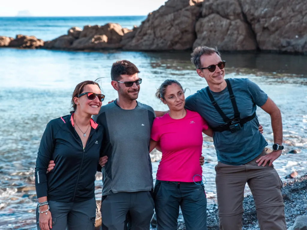 A team on the shore of Sant'Antioco during a Carolina Ranch team experience, Sardinia