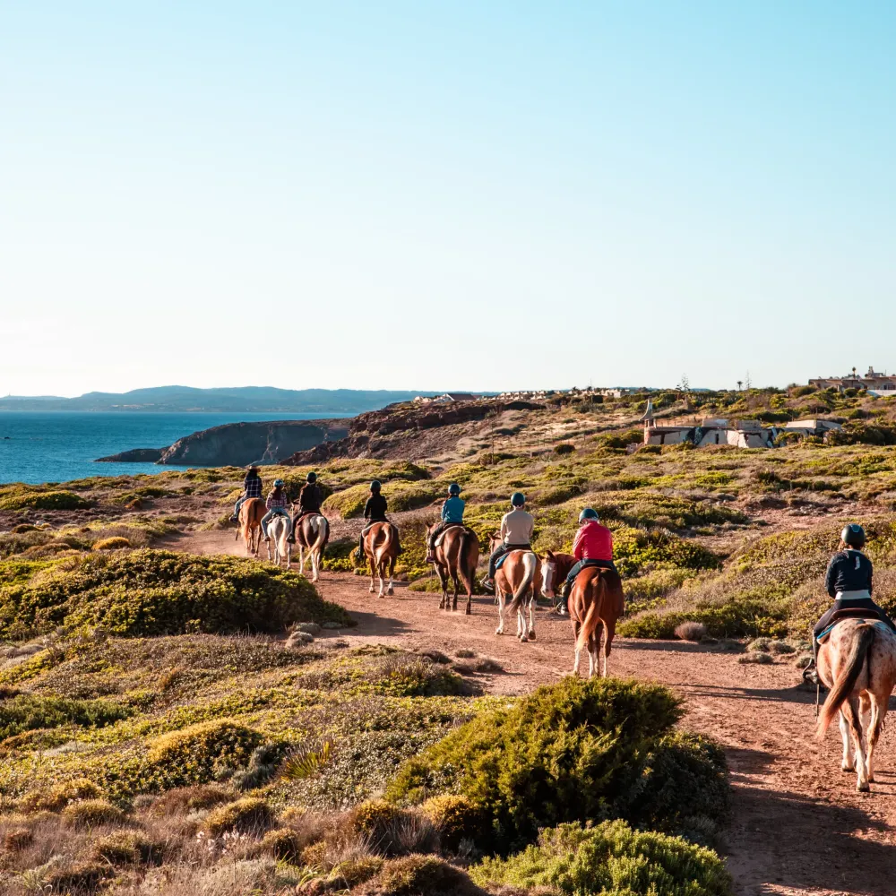A group riding along the coastal path of Sant'Antioco